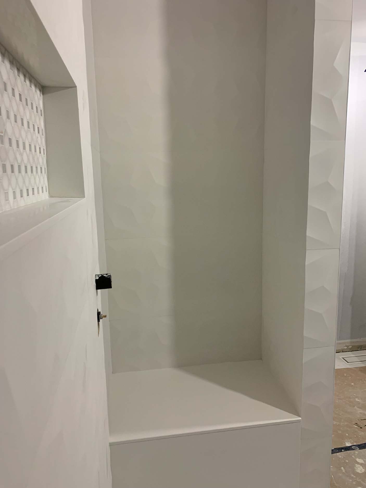 Modern shower tile installation in progress