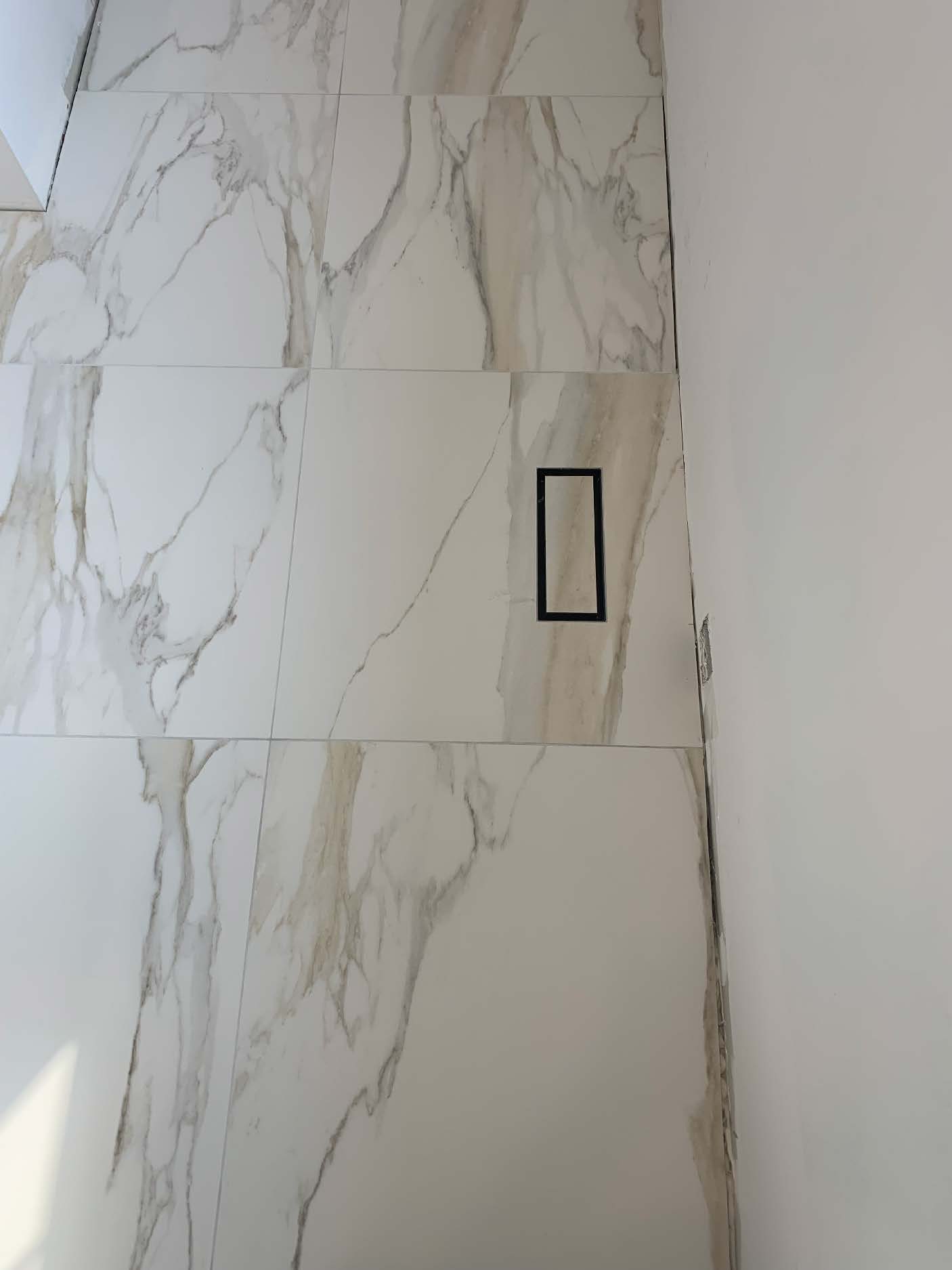Marble wall tile with custom black vent cover